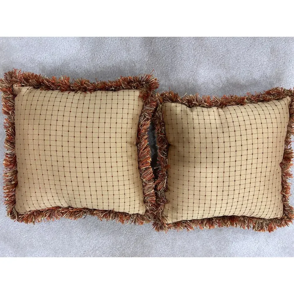 Pair of grid or checkpattern throw pillows orange brown gold